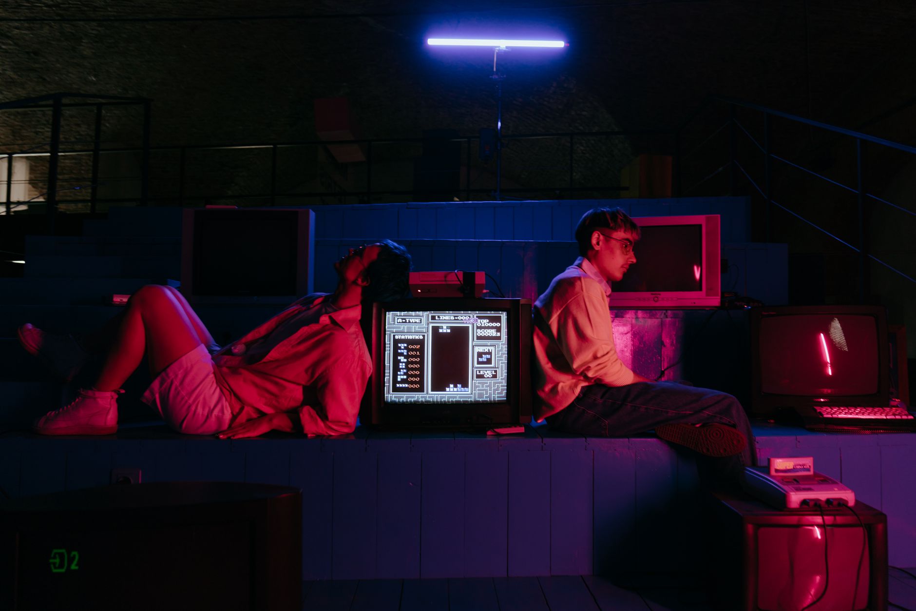 Gaming setups with neon lights and CRT monitor glow
